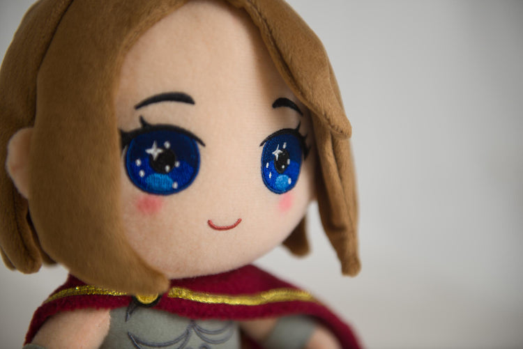 Elaine Collectible Plush, face close-up showing embroidered eyes