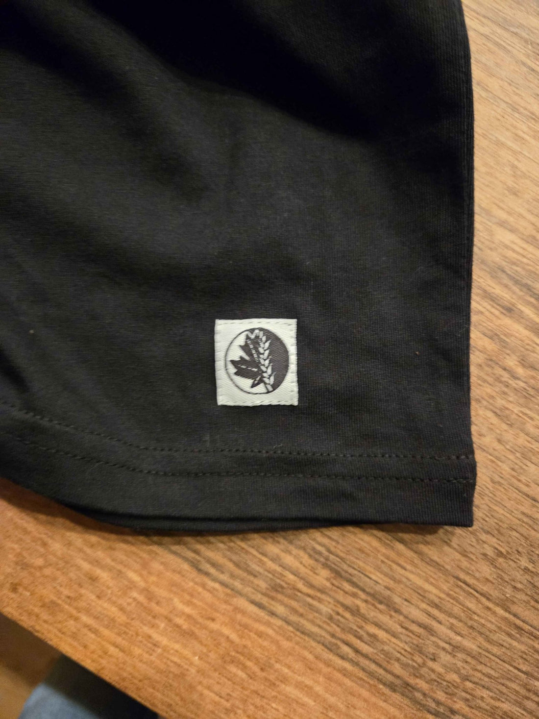 Picture of Fa Ram logo woven patch on t-shirt. 