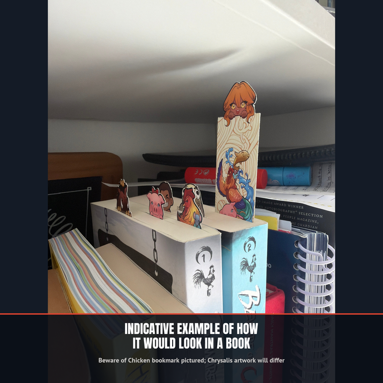 Indicative example of how a topper bookmark sits in a book (Beware of Chicken bookmark pictured; Chrysalis artwork will differ) — The Merch Guild